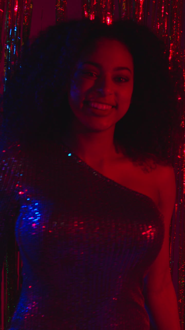 Vertical Video Of Young Woman In Nightclub Bar Or Disco Dancing With Sparkling Lights In Background 6