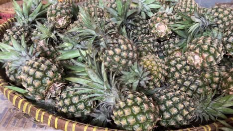a basket full of fresh pineapples