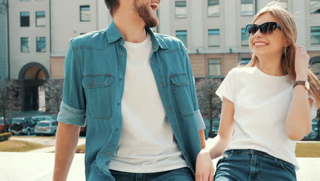 happy couple laughing outdoors