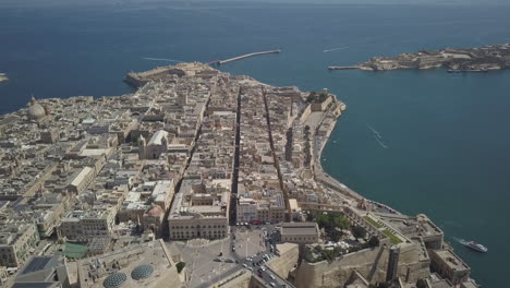 aerial drone shot flying above valletta, the capital city of malta