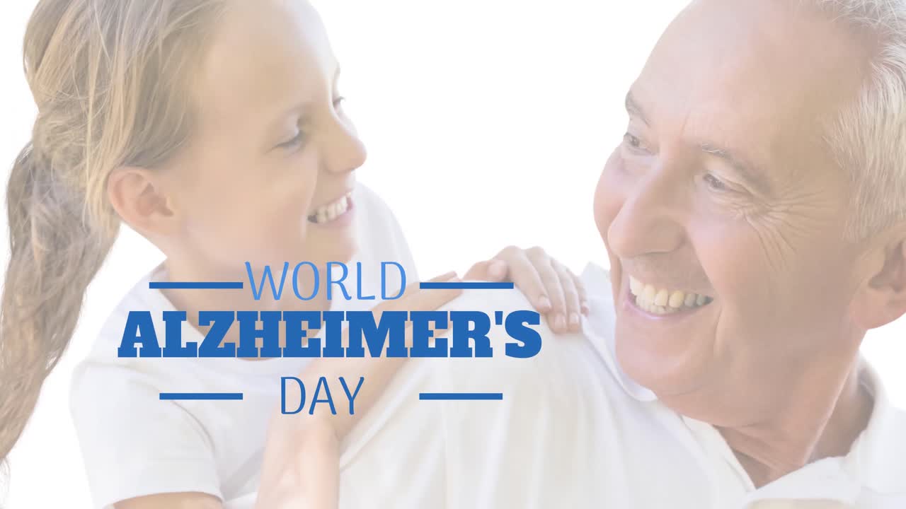 Animation of world alzheimer's day text over senior caucasian man with his granddaughter