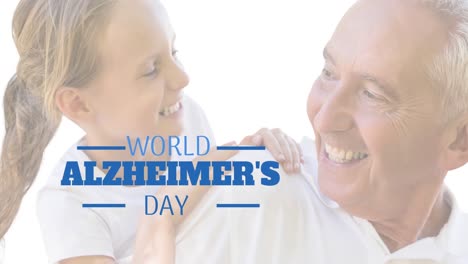 animation of world alzheimer's day text over senior caucasian man with his granddaughter