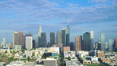 slow aerial establishing shot of the large skyscrapers in downtown los angeles