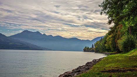 Fog-flowing-over-Attersee-lake,-time-lapse-view