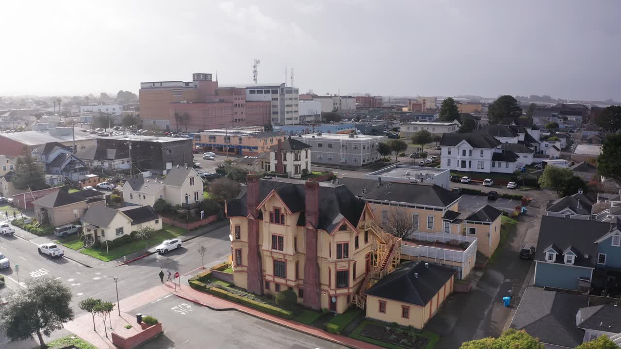 Descend aerial close-up shot of the Carter House Inns, a Victorian mansion located in historic Eureka, California. 4K