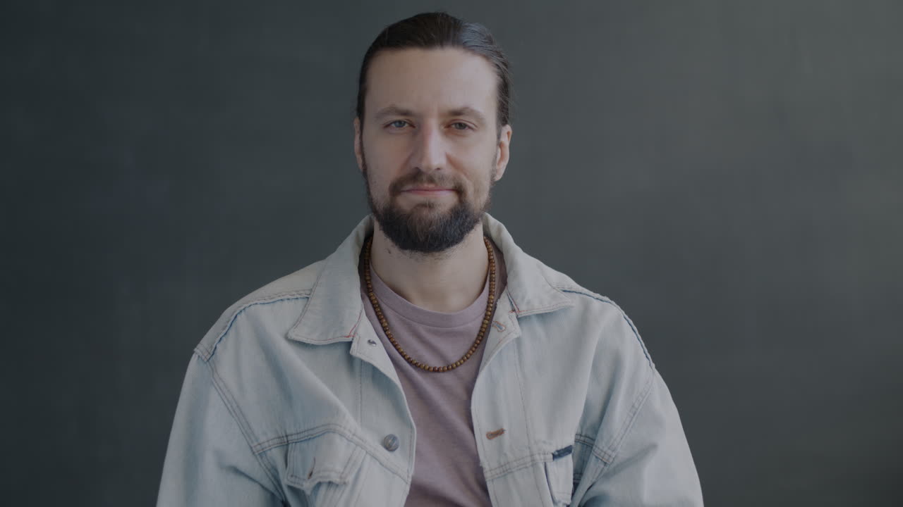 Man with a beard and denim jacket