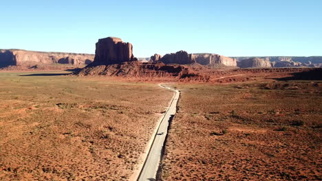 aerial view of cars driving through monument valley, tourist destination in arizona