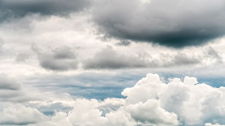 Timelapse shot of fast clouds moving along cinematic sky background at daytime