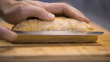 cutting a loaf of bread in half