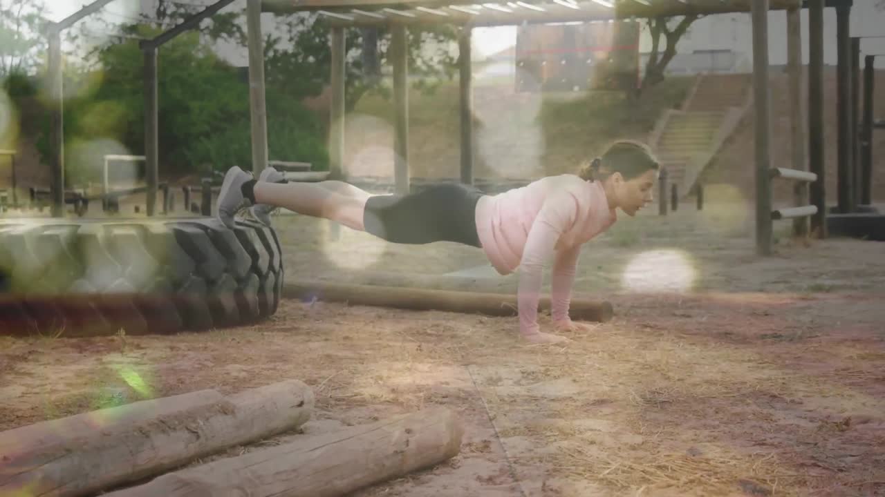 animación de puntos de luz sobre una mujer caucásica en una carrera de obstáculos haciendo flexiones