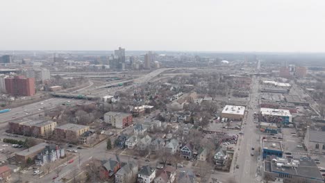 drone view of residential homes, streets, and freeways in minneapolis minnesota.
