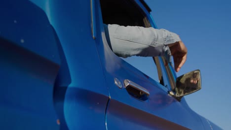 Young-man-on-a-road-trip-in-pick-up-truck