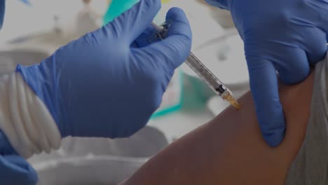 close-up of a person receiving the covid vaccine