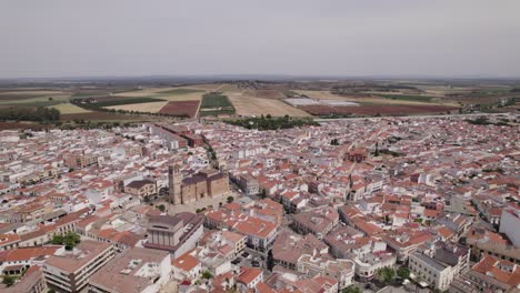 Aerial-establish-beautiful-roman-European-city-Montijo-in-Spain,-centred-church