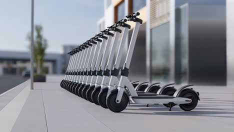 a line of modern electric scooters parked on a city sidewalk next to a building