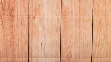 a yellow ball bounces across vertical wooden panels, showcasing dynamic motion and interaction.