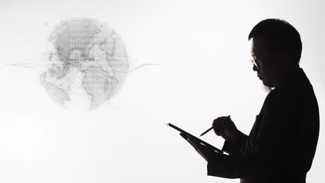 silhouette of a man using a tablet to solve a global issue - white background