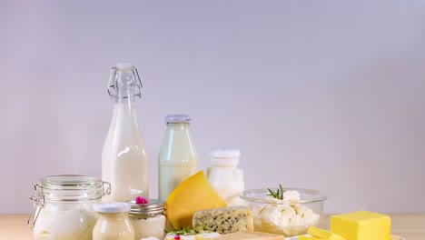 assorted dairy items arranged on a wooden surface