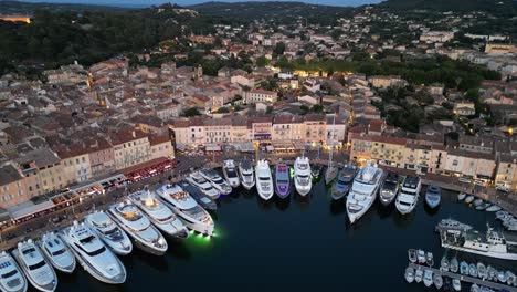 Pull-back-drone-aerial-reverse-reveal-Saint-Tropez-France-evening