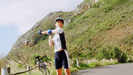 middle age woman stretching on country road 4k