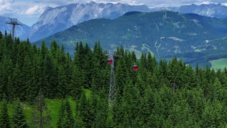 passengers travelling in the most picturesque way above the mountains of austria