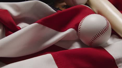 close up baseball still life with bat and ball on american flag 2