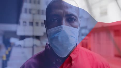 czech republic flag waving against man wearing face mask