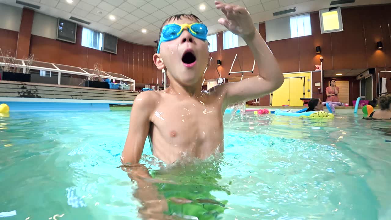 Boy having fun underwater in swimming pool