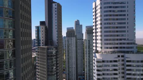 flight between skyscrapers in puerto madero, buenos aires, argentina on a clear day