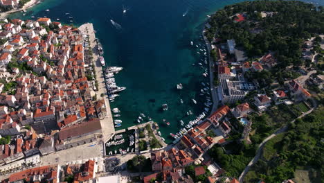 hvar old town and marina with otok galisnik island in croatia. - aerial shot