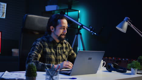 focused freelancer working from home, typing on laptop