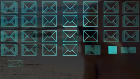 animation of multiple neon message icons over mid section of woman using smartphone at the beach