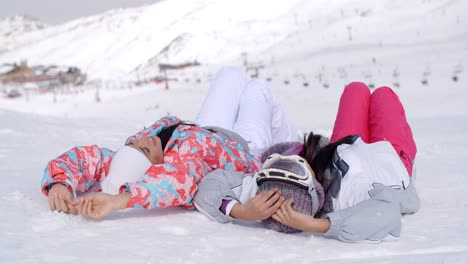 Two-skiers-laying-on-the-ground