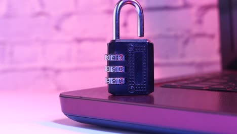 combination lock on laptop: cybersecurity and data protection