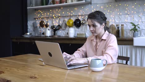 woman working from home in a kitchen