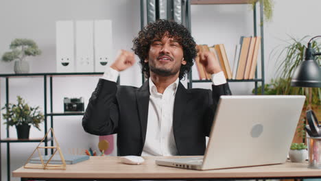 happy amazed businessman shocked by sudden victory game winning lottery goal achievemen good news
