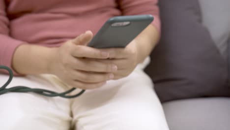 Detail-of-female-hands-using-cell-phone