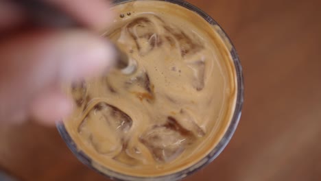 iced coffee drink being stirred