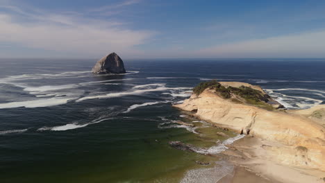 coastal scenery of a rocky beach with a prominent rock formation