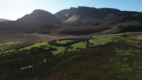 flying slow over sheep pen and towards quiraing rock formations at the trotternish ridge isle of skye scotland