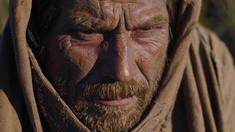 ancient man in a desert landscape