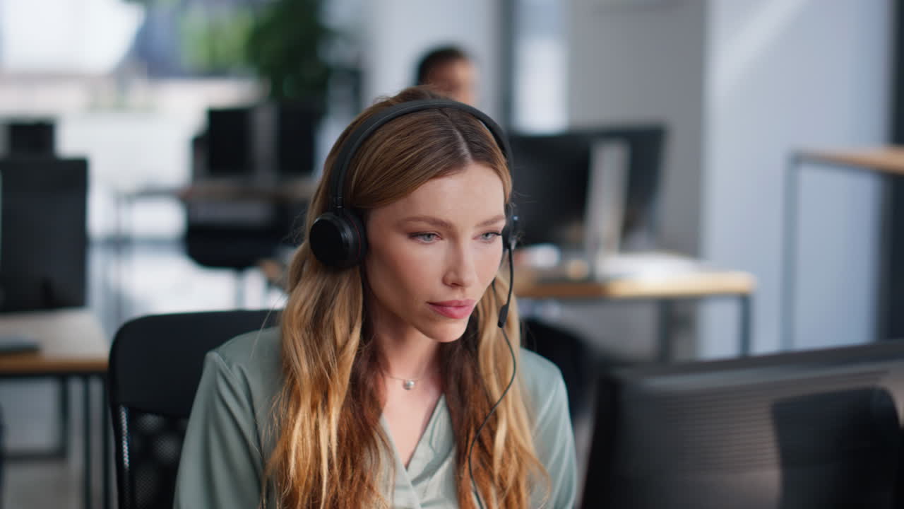 Helpline woman start work wearing headset in modern office open space closeup