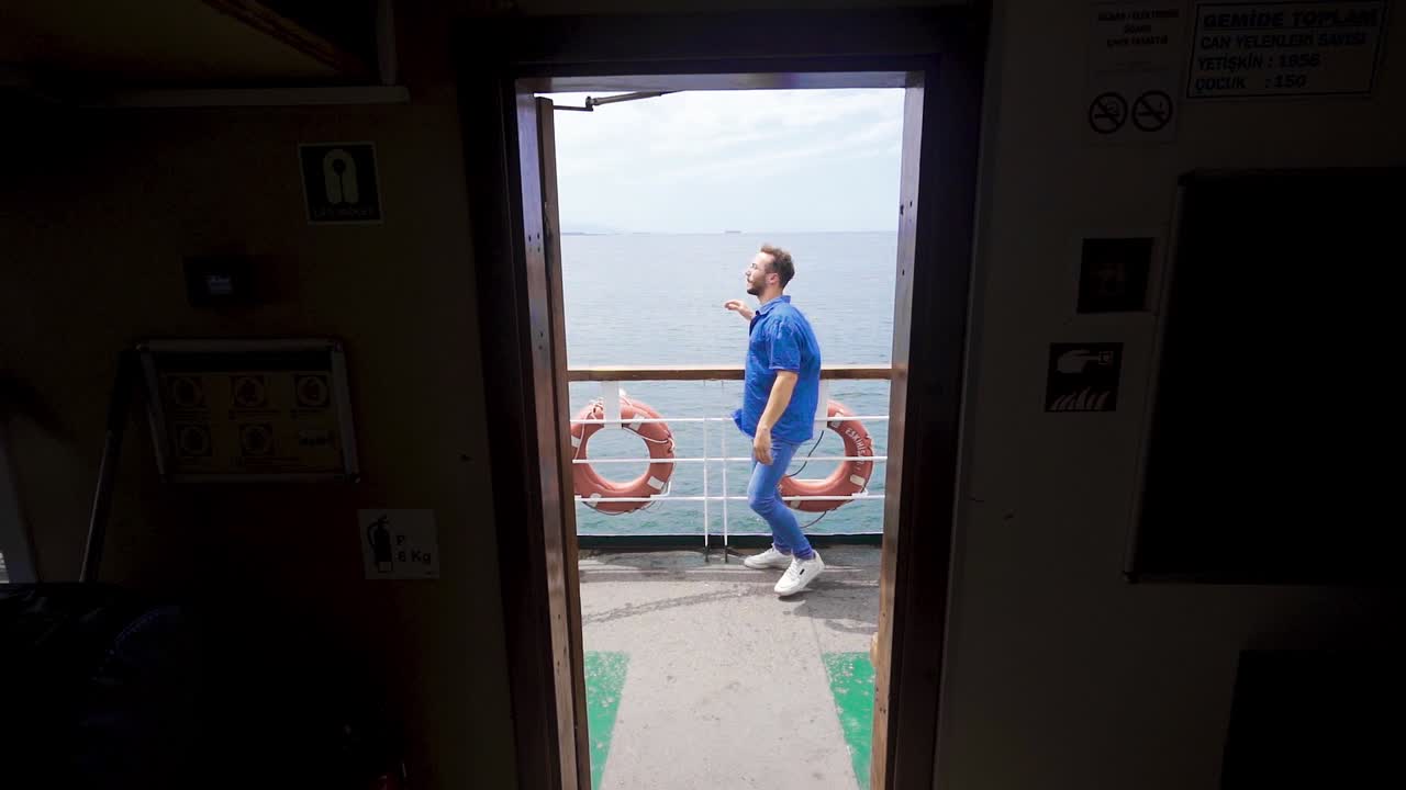 Traveler man dancing on sea voyage. Slow Motion.