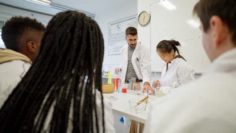 science class with students and teacher in laboratory