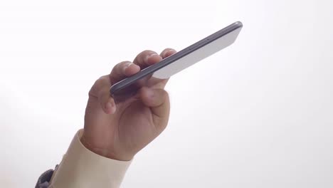 Hand-of-a-person-holding-a-phone-and-sliding-your-finger-up-on-the-screen