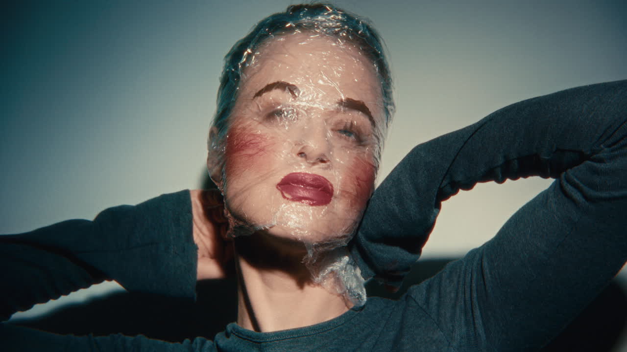 Woman with Plastic Wrap on Face