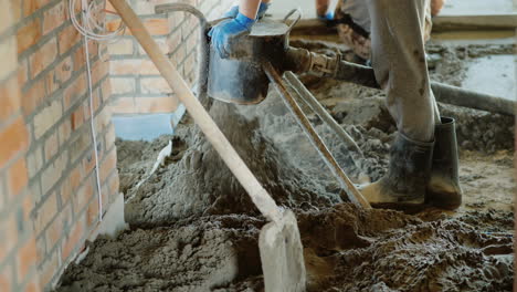 The-Builder-Puts-A-Semi-Dry-Mortar-For-Finishing-The-Floor