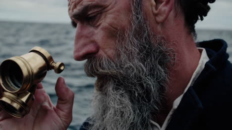 elderly sea captain observing the horizon
