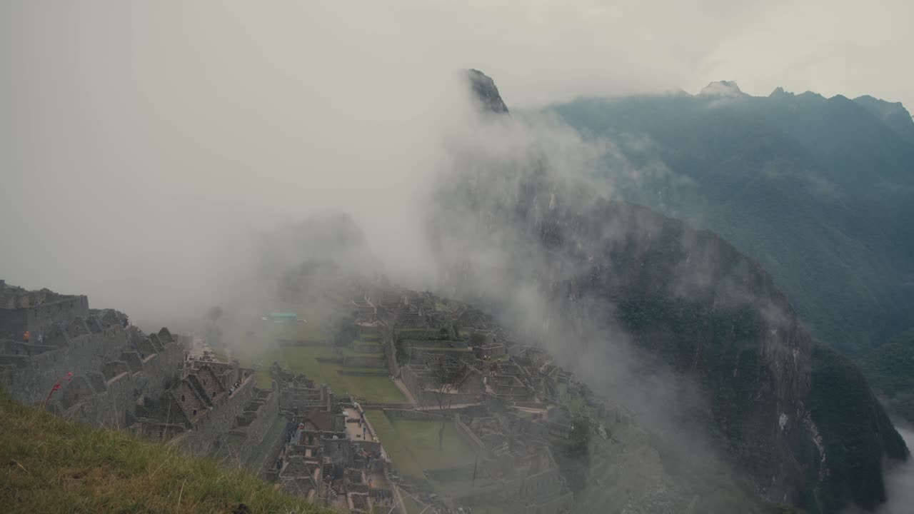 Foggy Clouds Over Historical and Natural Sanctuary of Machu Picchu In Urubamba, Cusco In Peru. Aerial Drone Shot