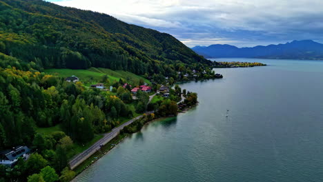 aerial natural lake location green hills and waterside road mountainous blue sky